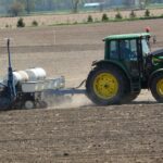 Planter going through a field for seeding